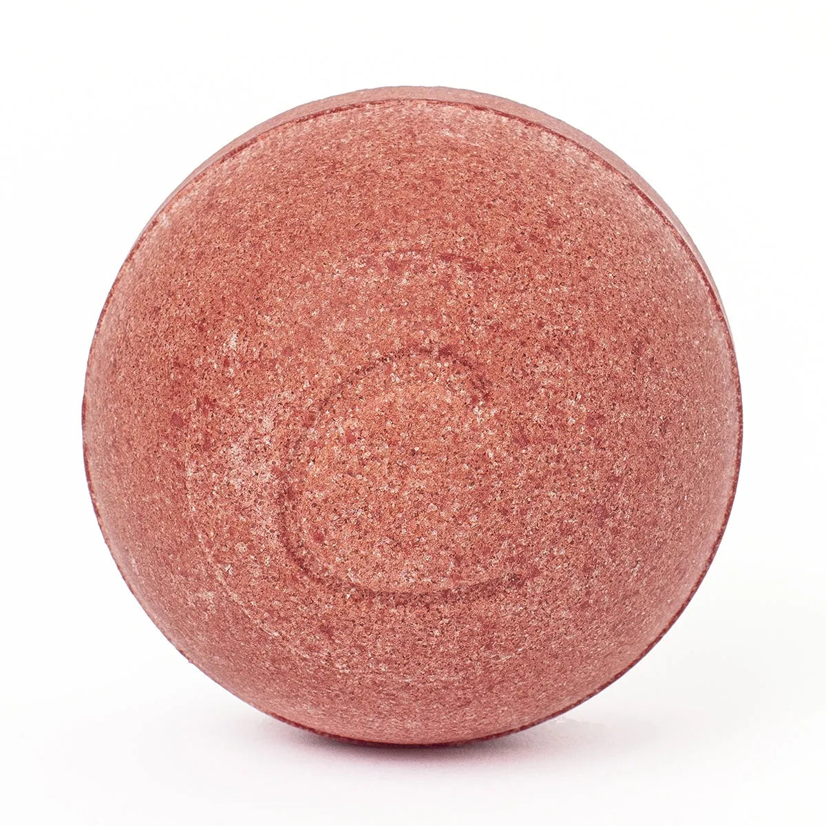 Round, textured hibiscus-red bath bomb isolated on a clean white background.
